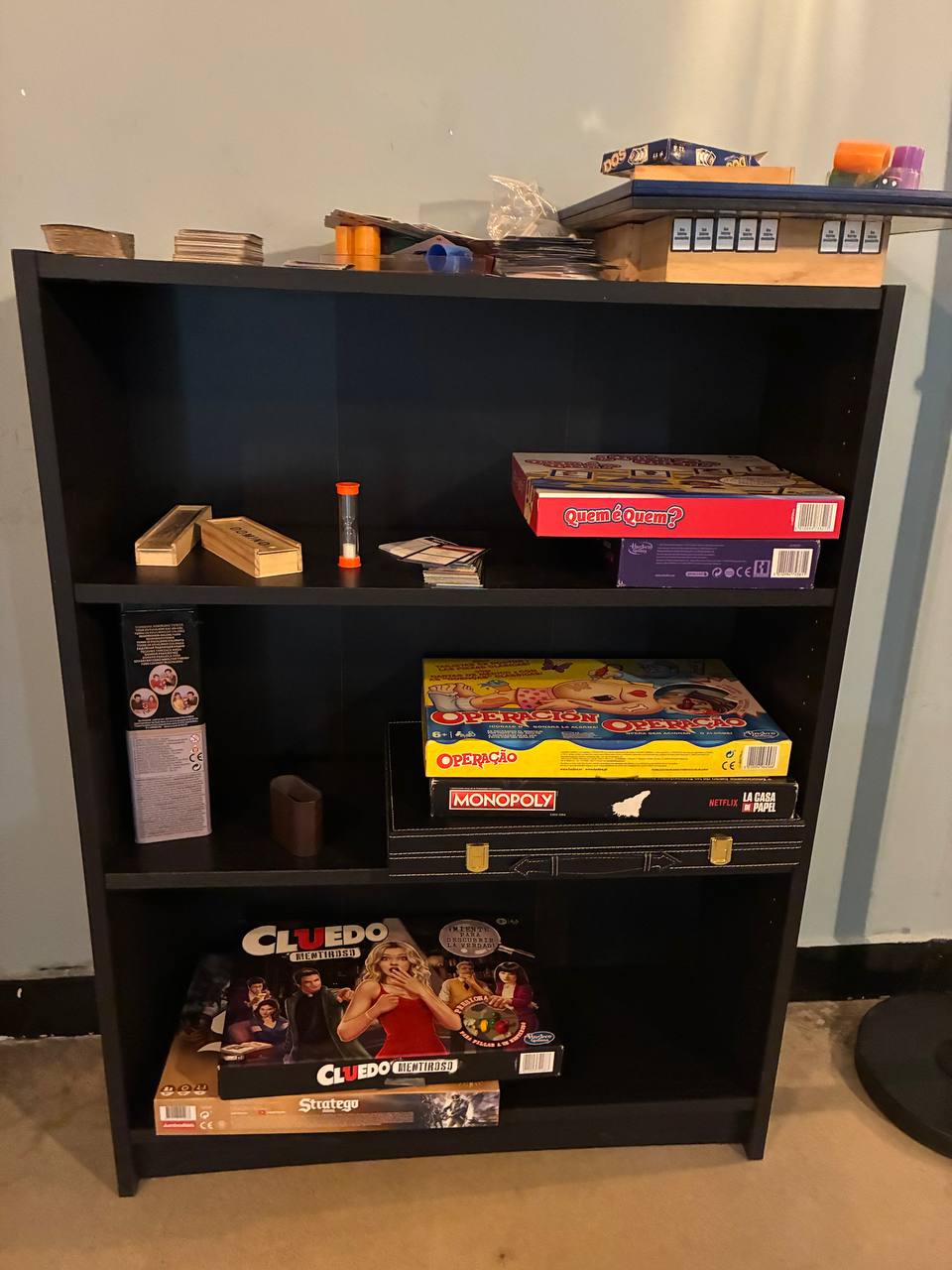 The board game shelf. Thursday fills this room.